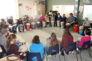 Leo Brooks of treefrogpercussion.ca leads Ms Schall’s grade 8 class in a drum building and beating workshop at GREC